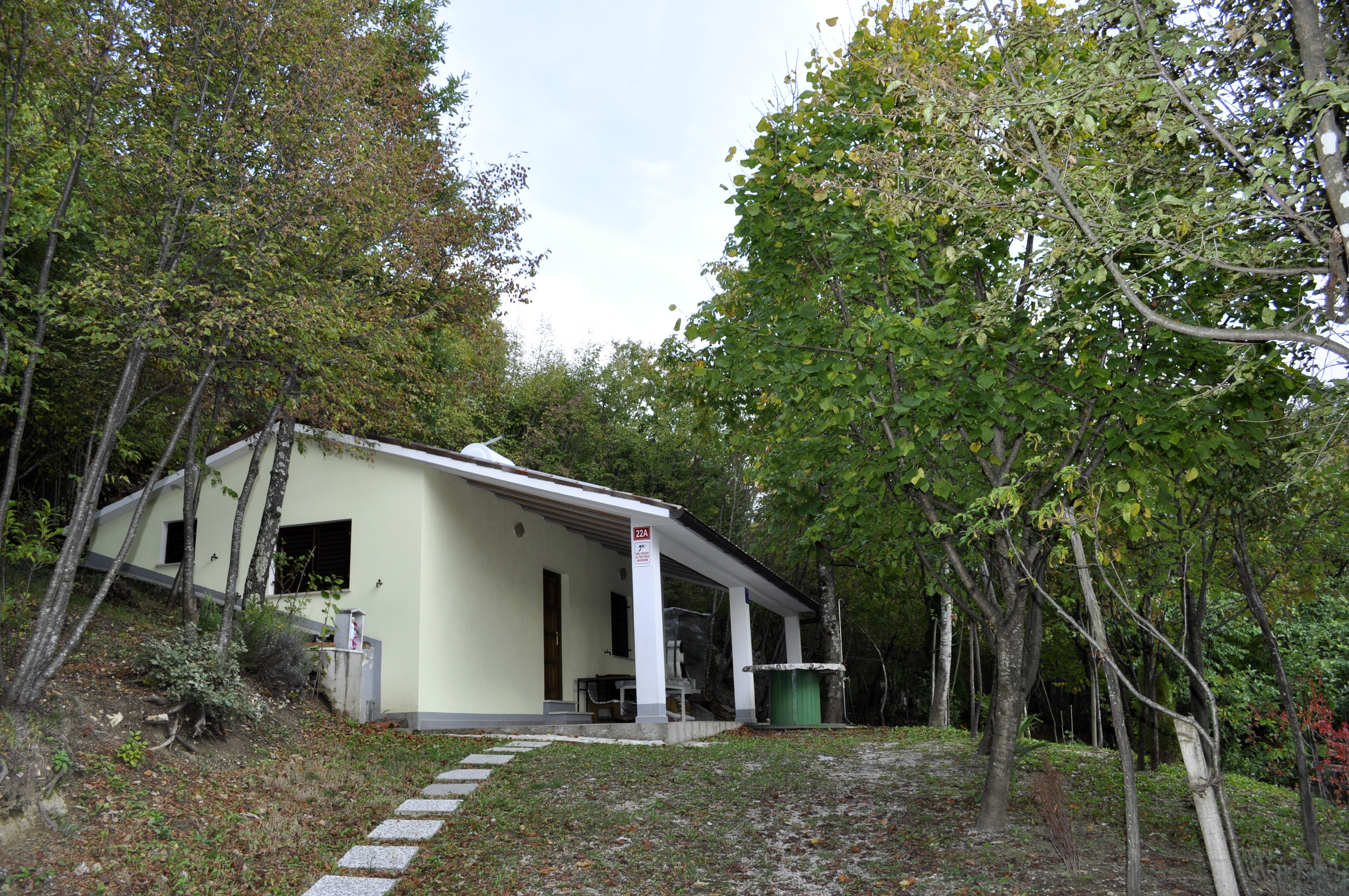 Unusual house in a forest on a glade with panoramic view
