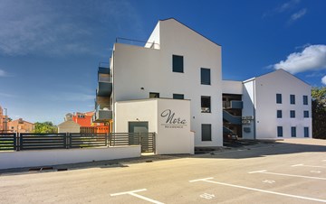 The modern building near the sea offers comfortable accommodation