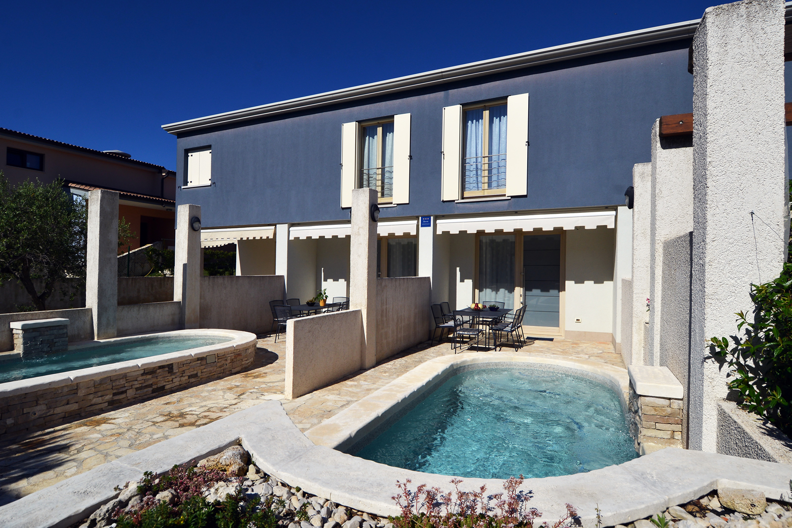 Beautiful three-storey villa with 2 swimming pools and a terrace