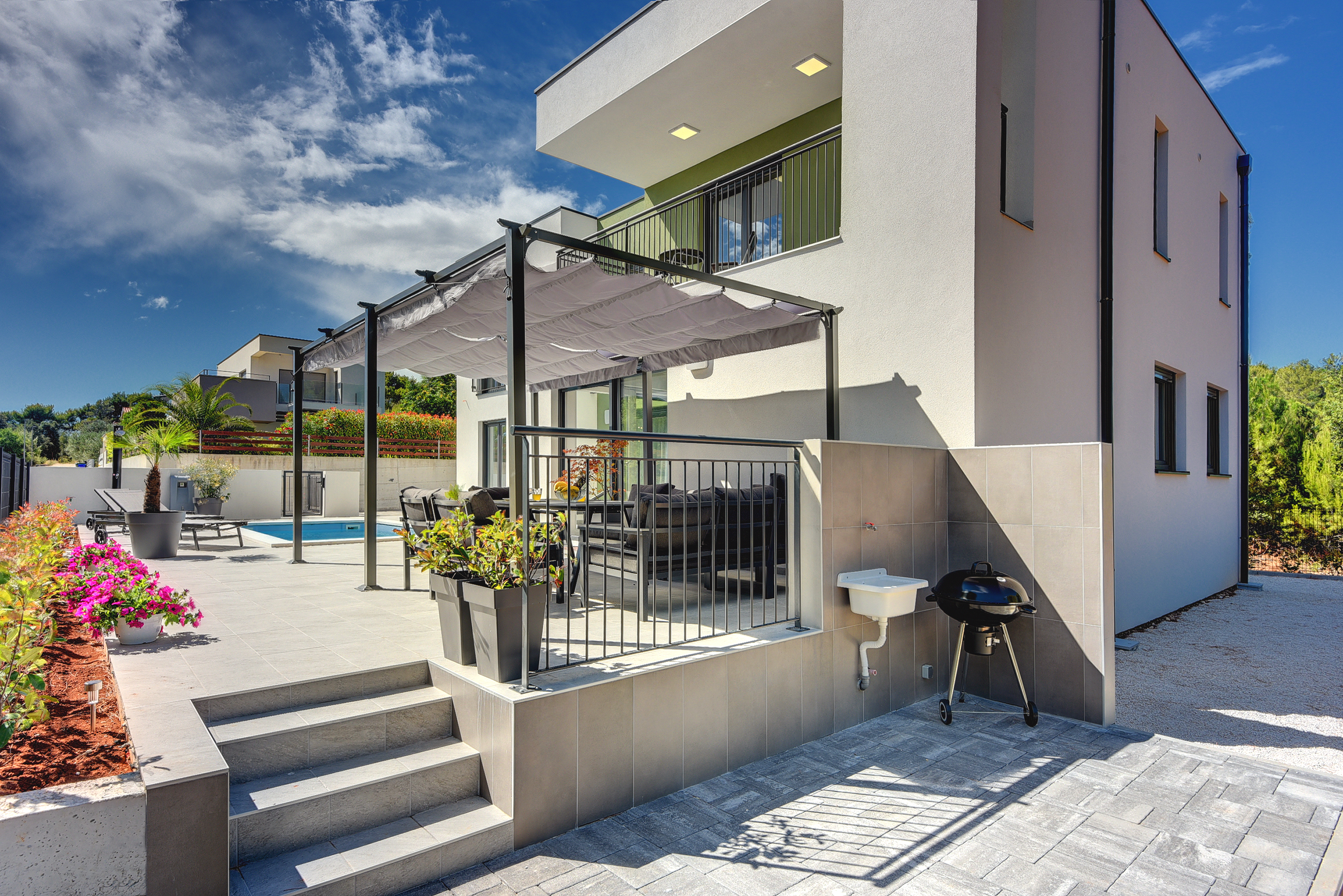 Modern villa surrounded by greenery with private pool