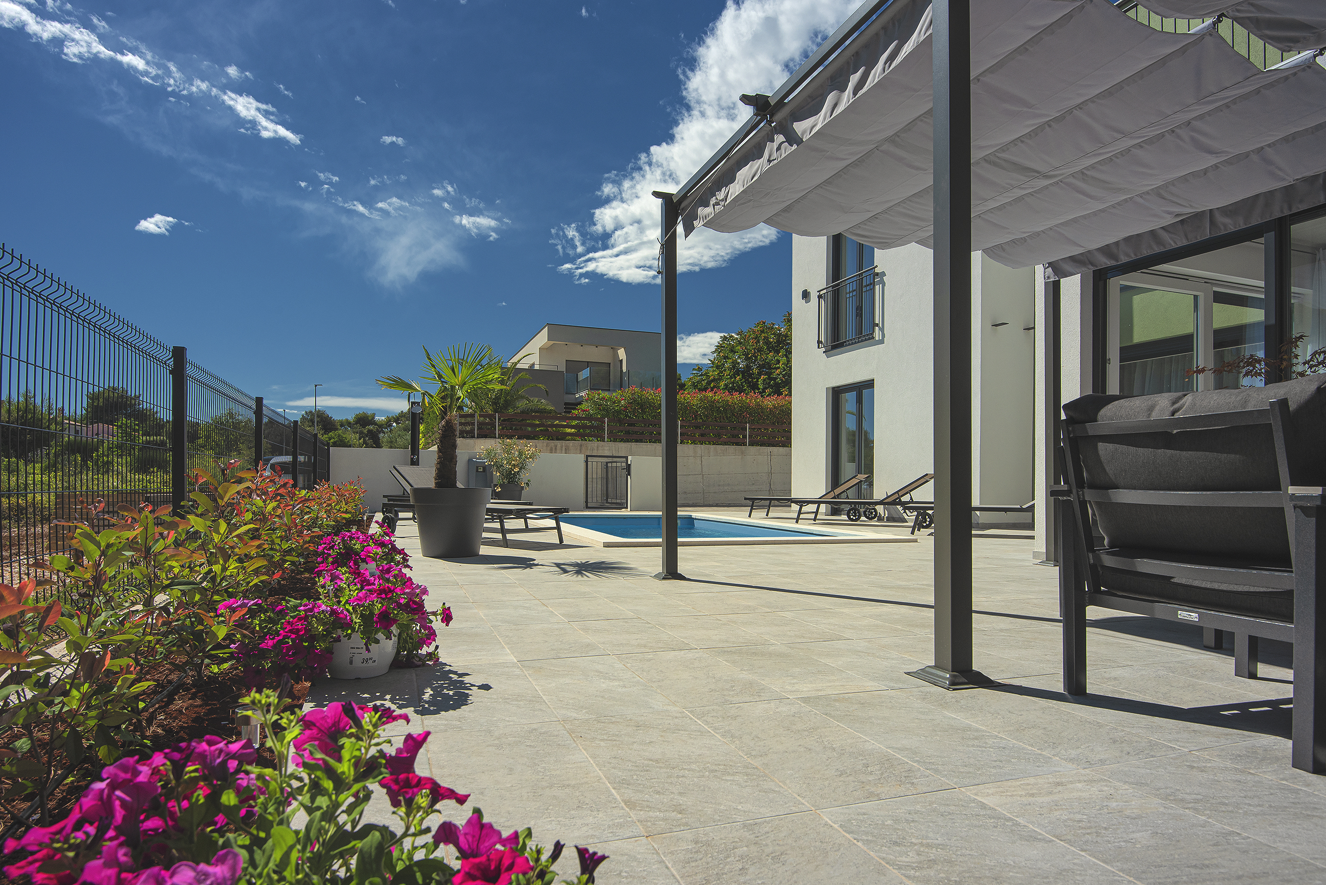 Modern villa surrounded by greenery with private pool