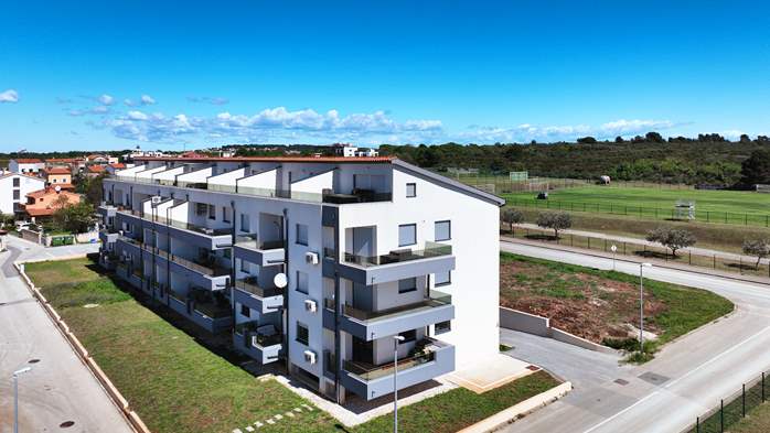 A modern building offers accommodation not far from the beach, 13