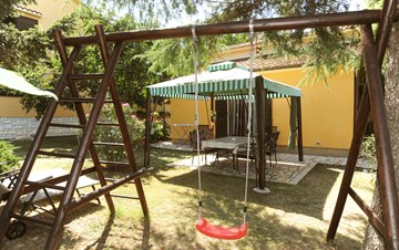 Holiday home in Medulin with private garden and playground