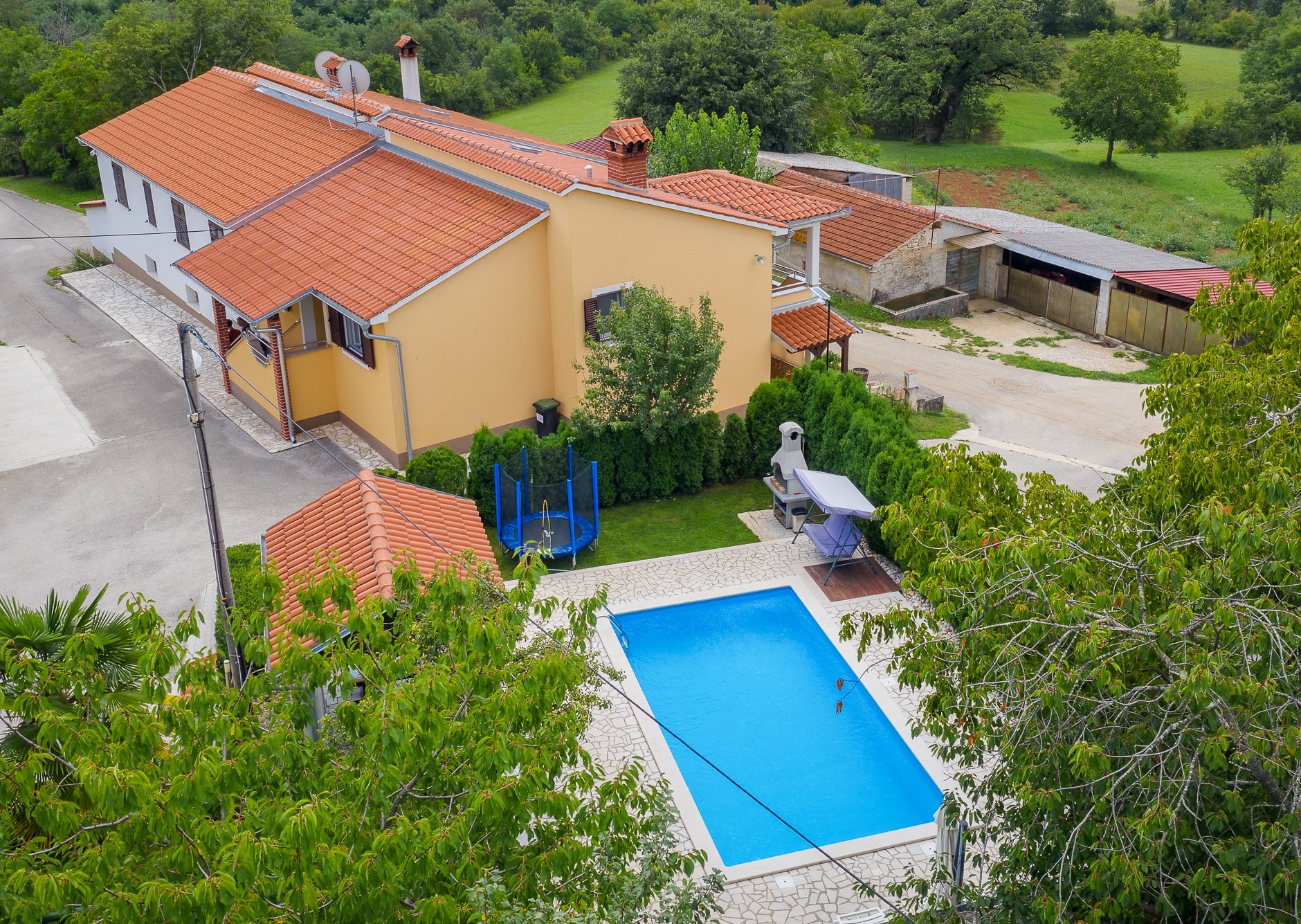 Villa with swimming pool, children playground and outside kitchen