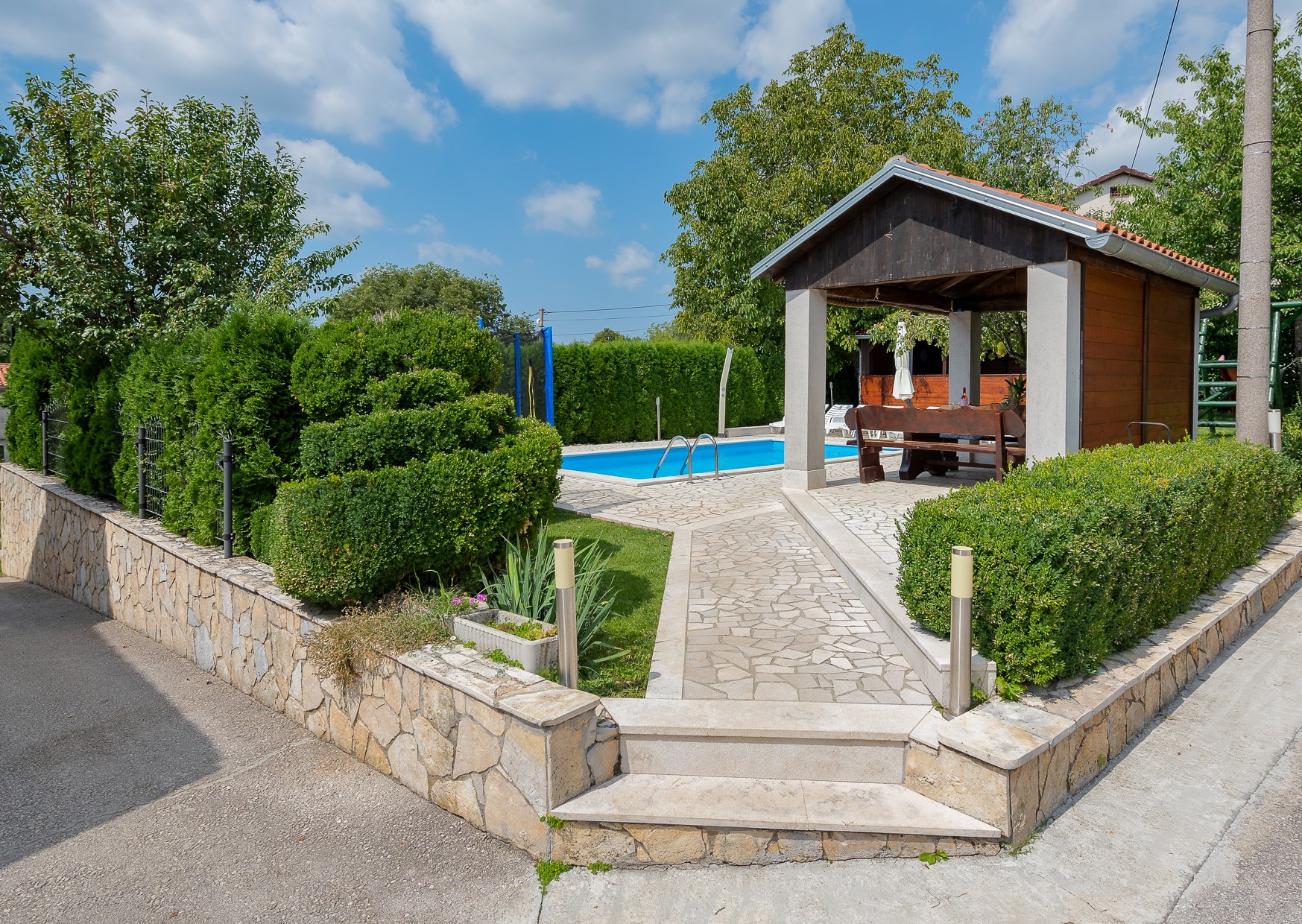 Villa with swimming pool, children playground and outside kitchen