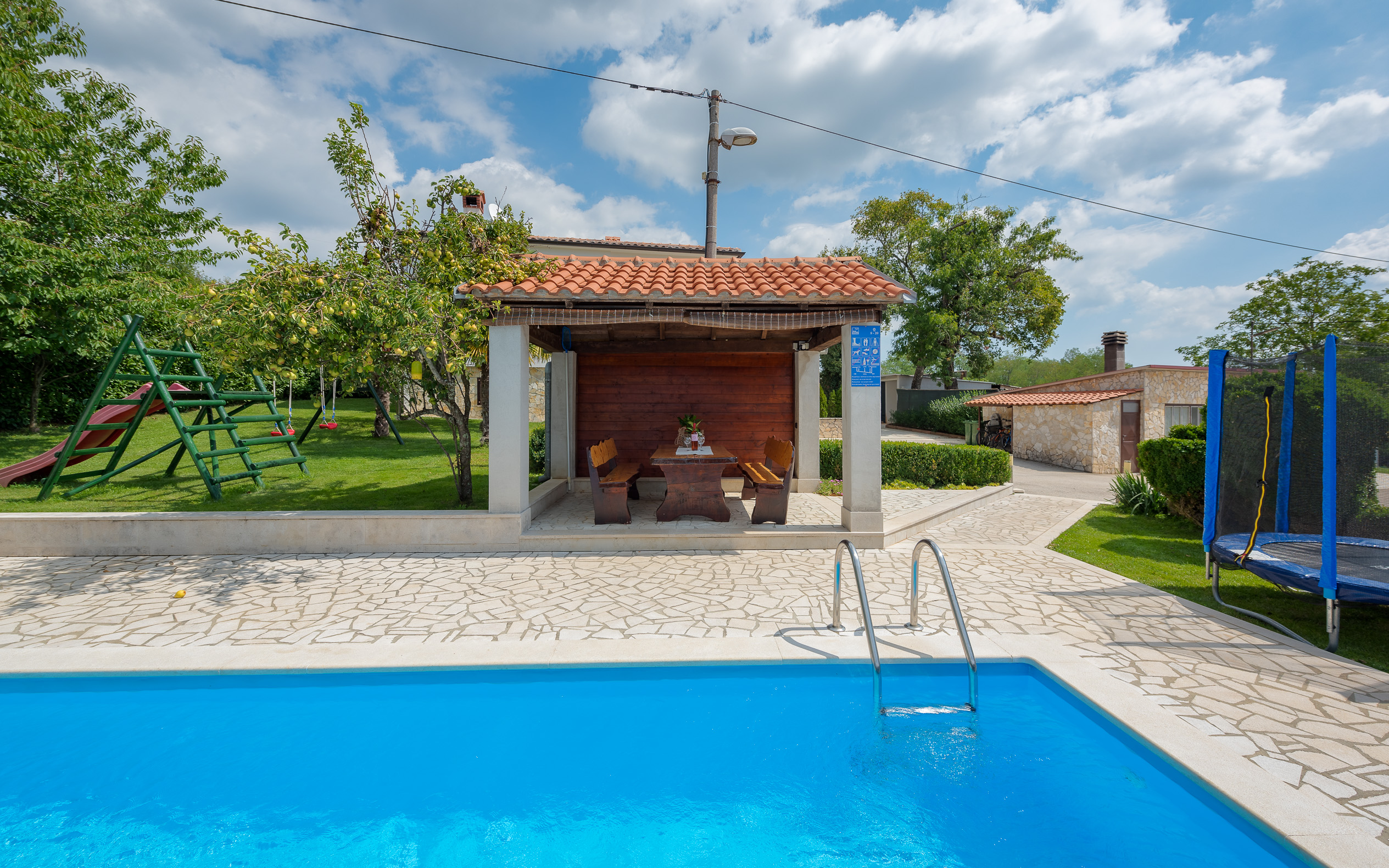 Villa with swimming pool, children playground and outside kitchen