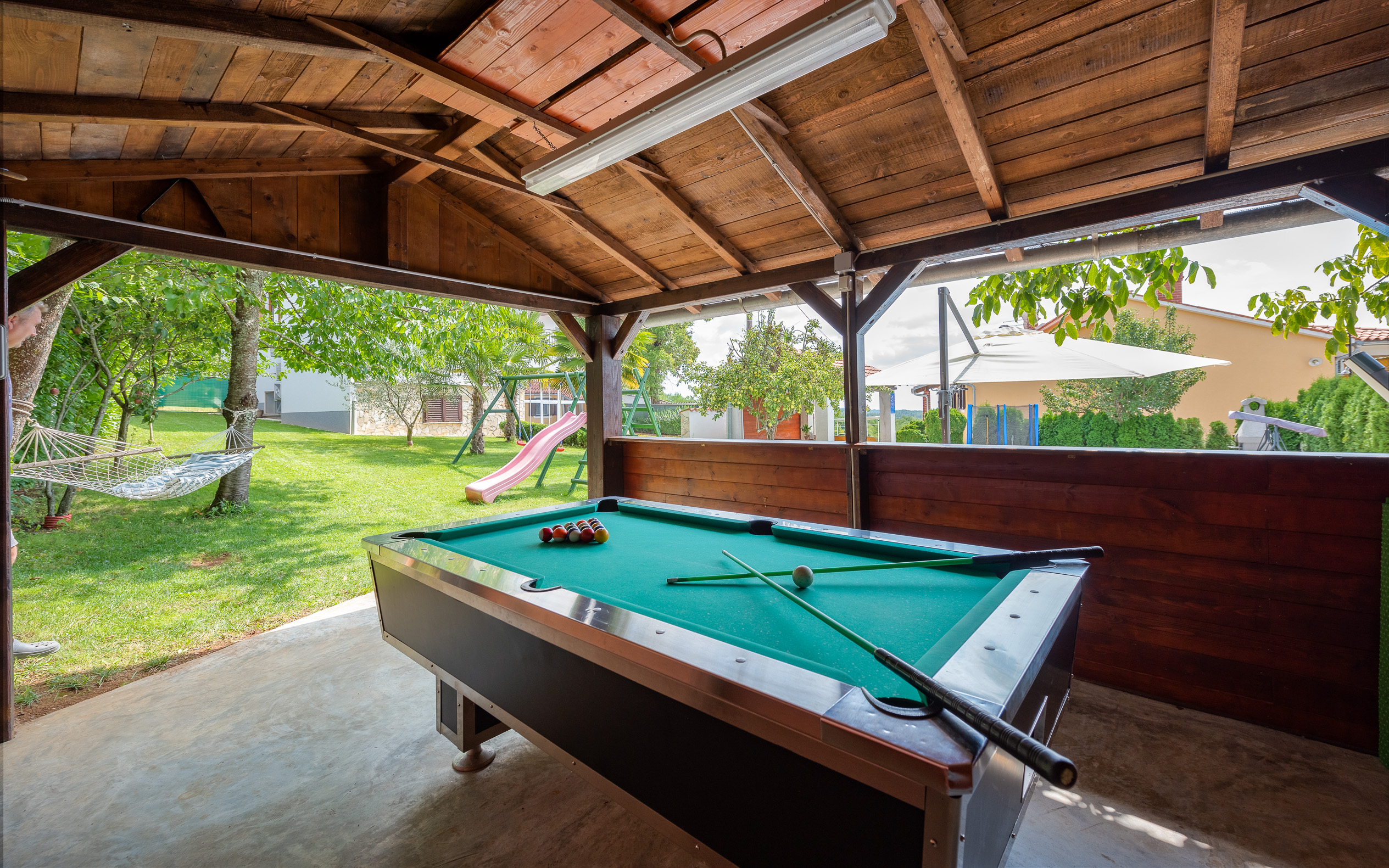 Villa with swimming pool, children playground and outside kitchen