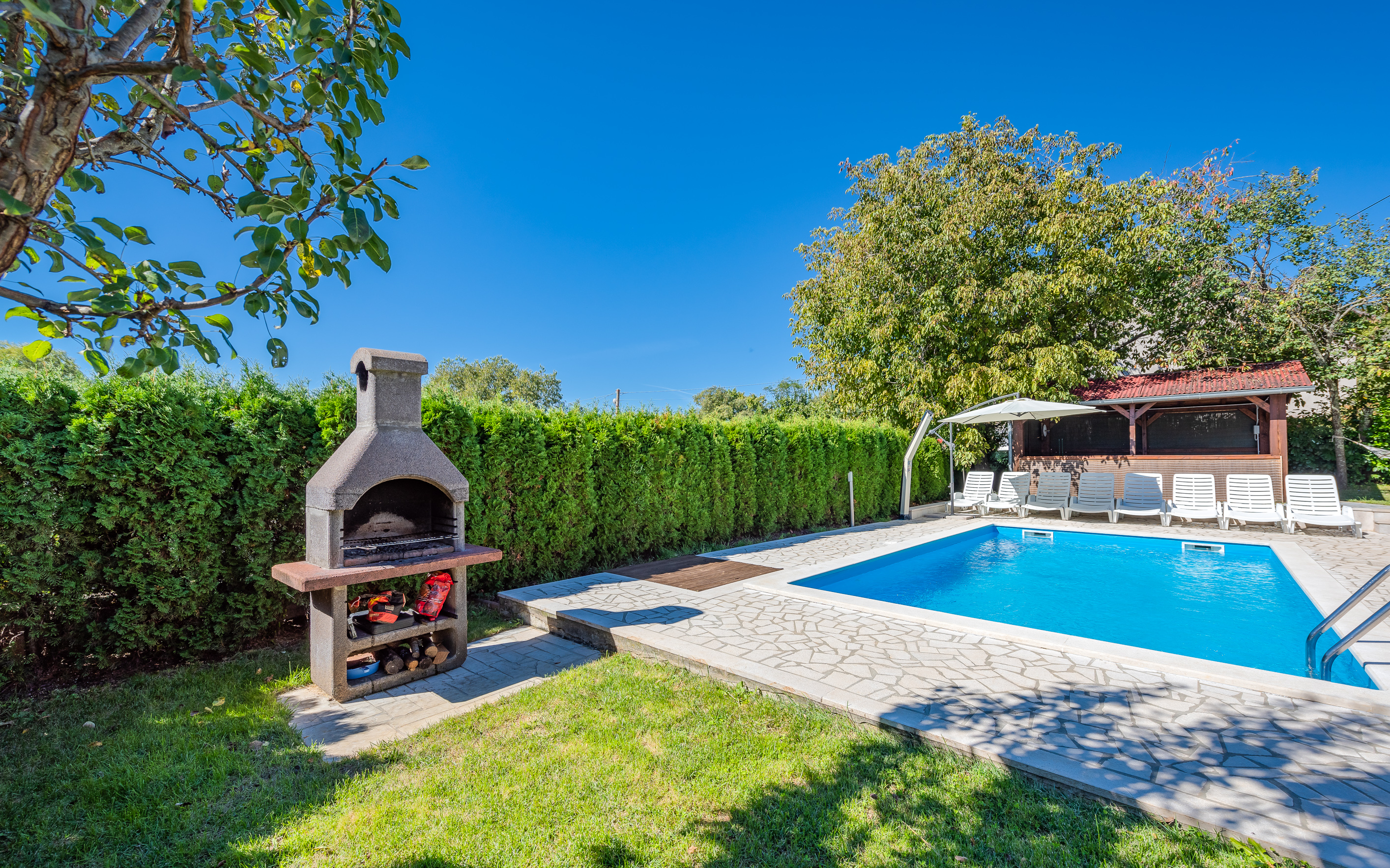 Villa with swimming pool, children playground and outside kitchen