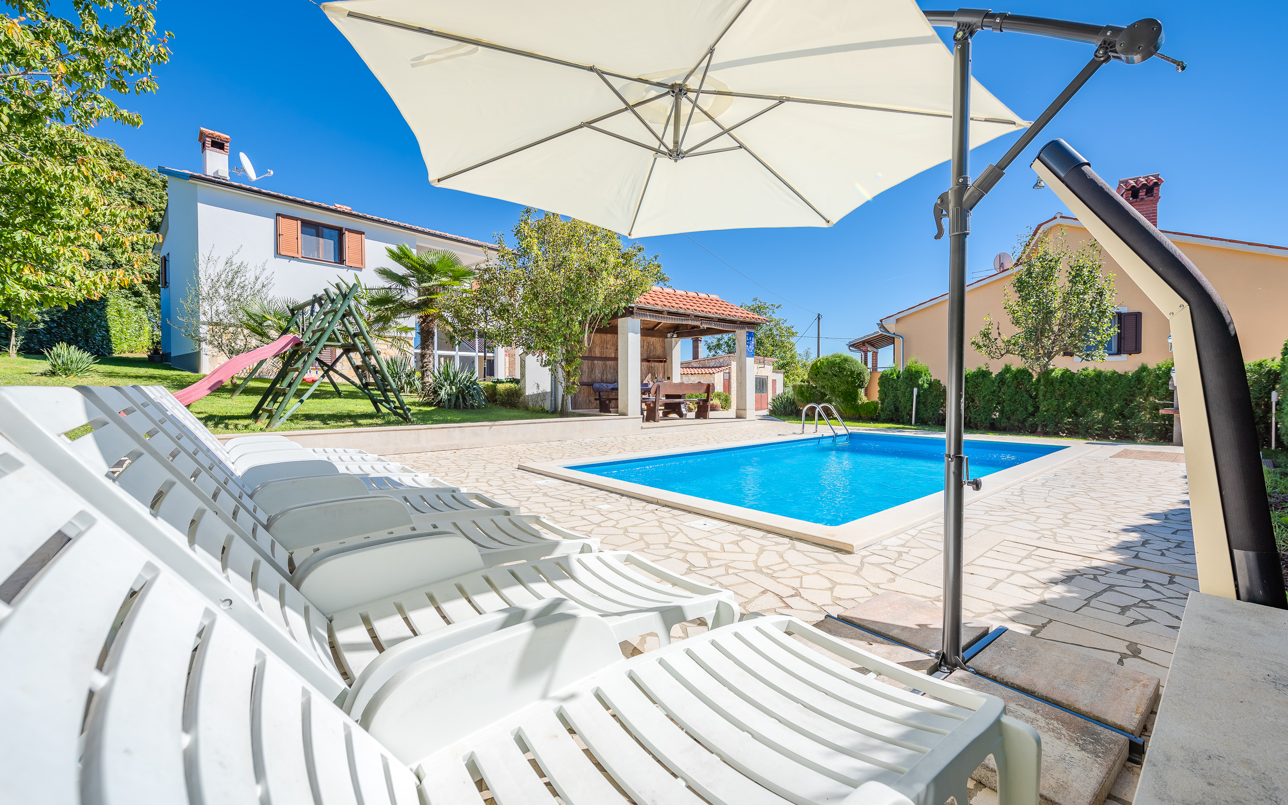 Villa with swimming pool, children playground and outside kitchen