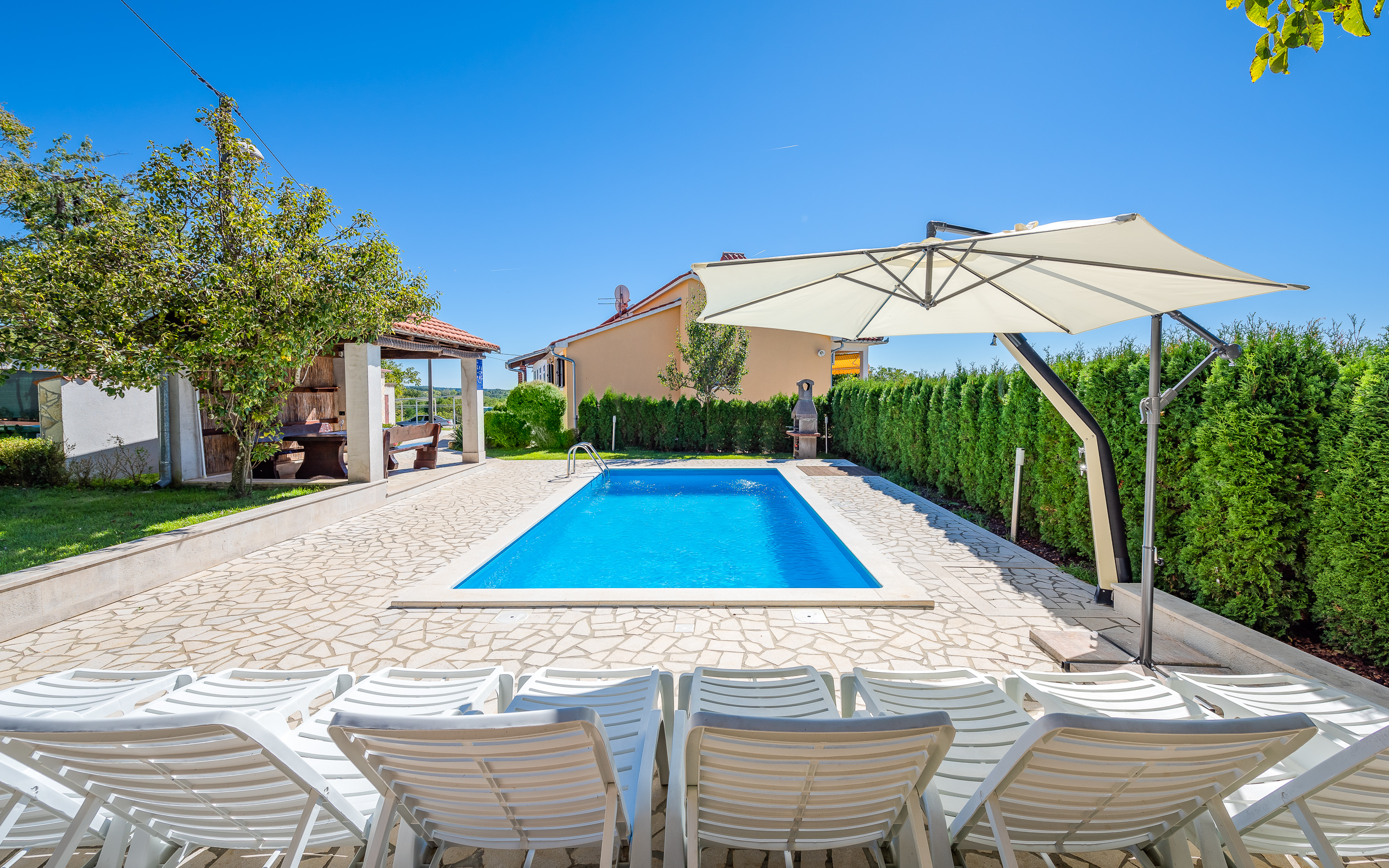Villa with swimming pool, children playground and outside kitchen
