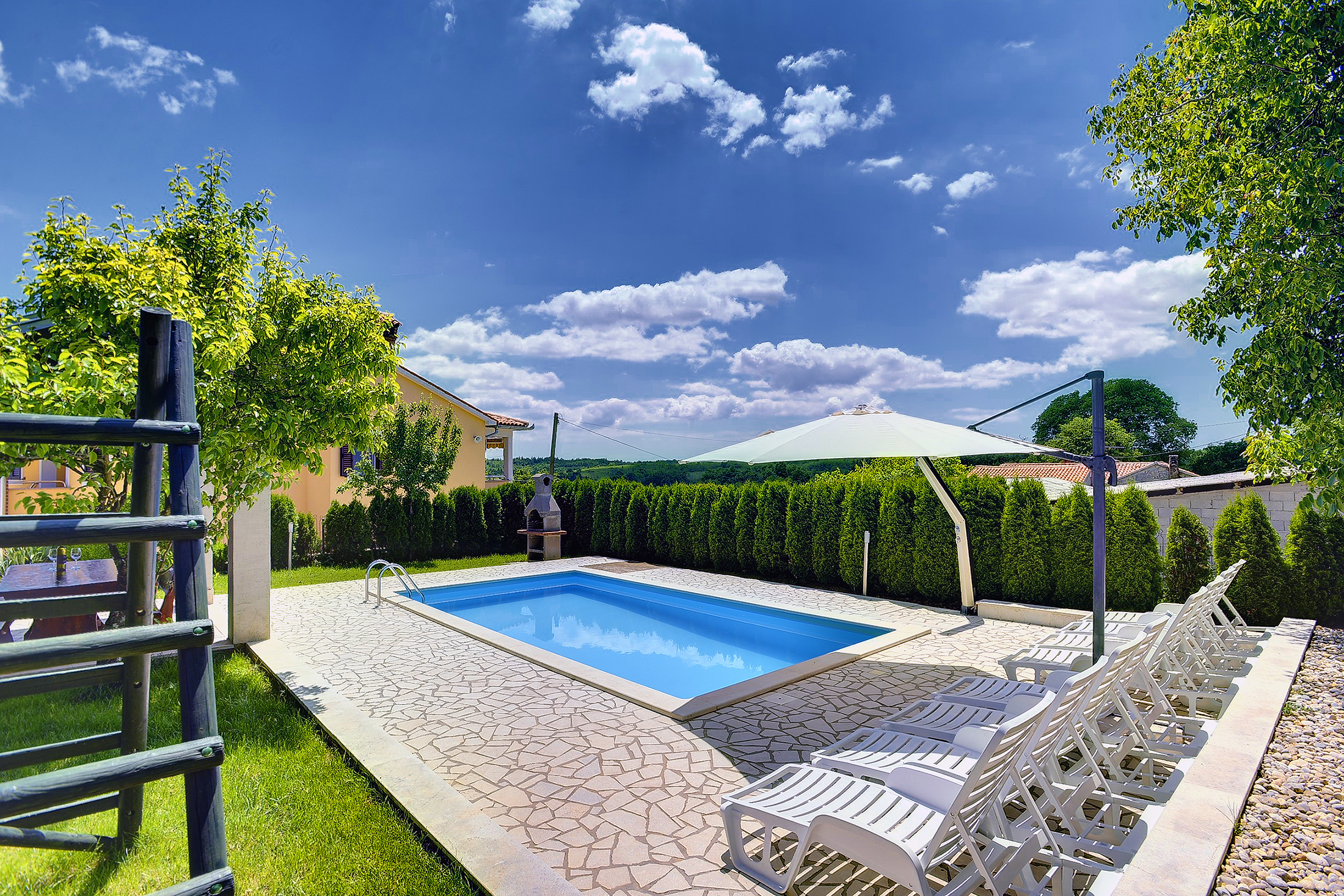 Villa with swimming pool, children playground and outside kitchen
