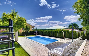 Villa with swimming pool, children playground and outside kitchen
