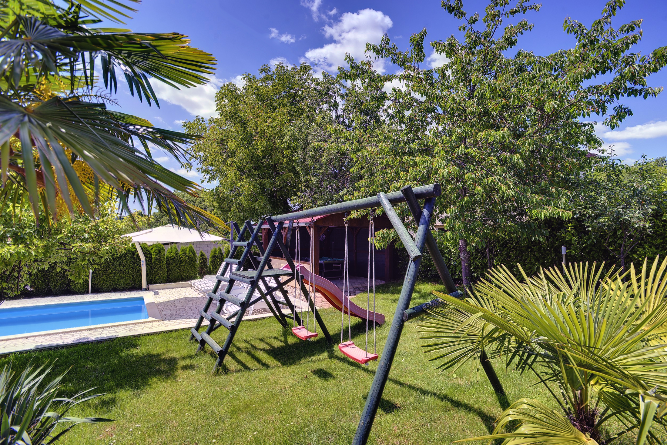 Villa with swimming pool, children playground and outside kitchen
