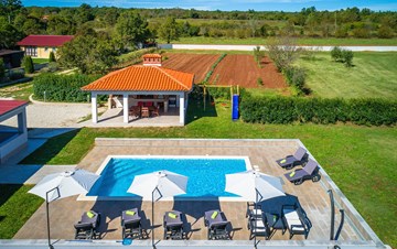 Holiday home with pool with whirlpool and playground for kids