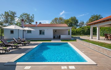 Holiday home with pool with whirlpool and playground for kids