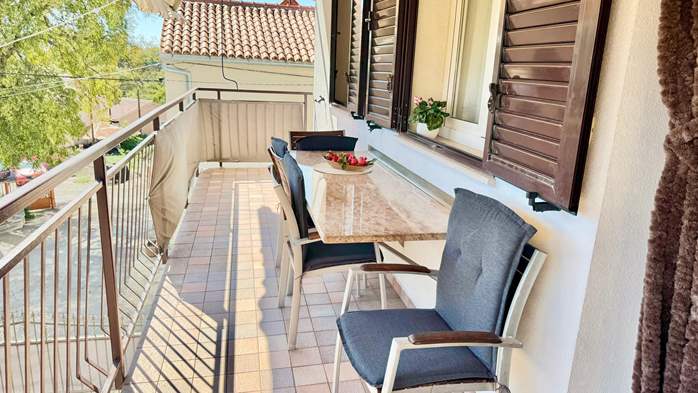 Two-bedroom apartment with shared outdoor pool and balcony, 15