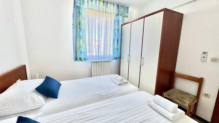 Two-bedroom apartment with shared outdoor pool and balcony, 13