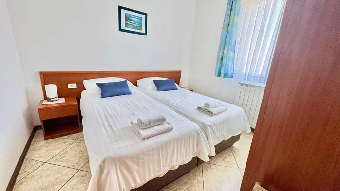 Two-bedroom apartment with shared outdoor pool and balcony, 11